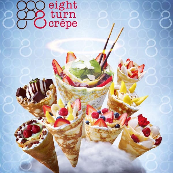 Assortment of Eight Turn Crepe's sweet crepes with fruits, ice cream, and whipped cream.